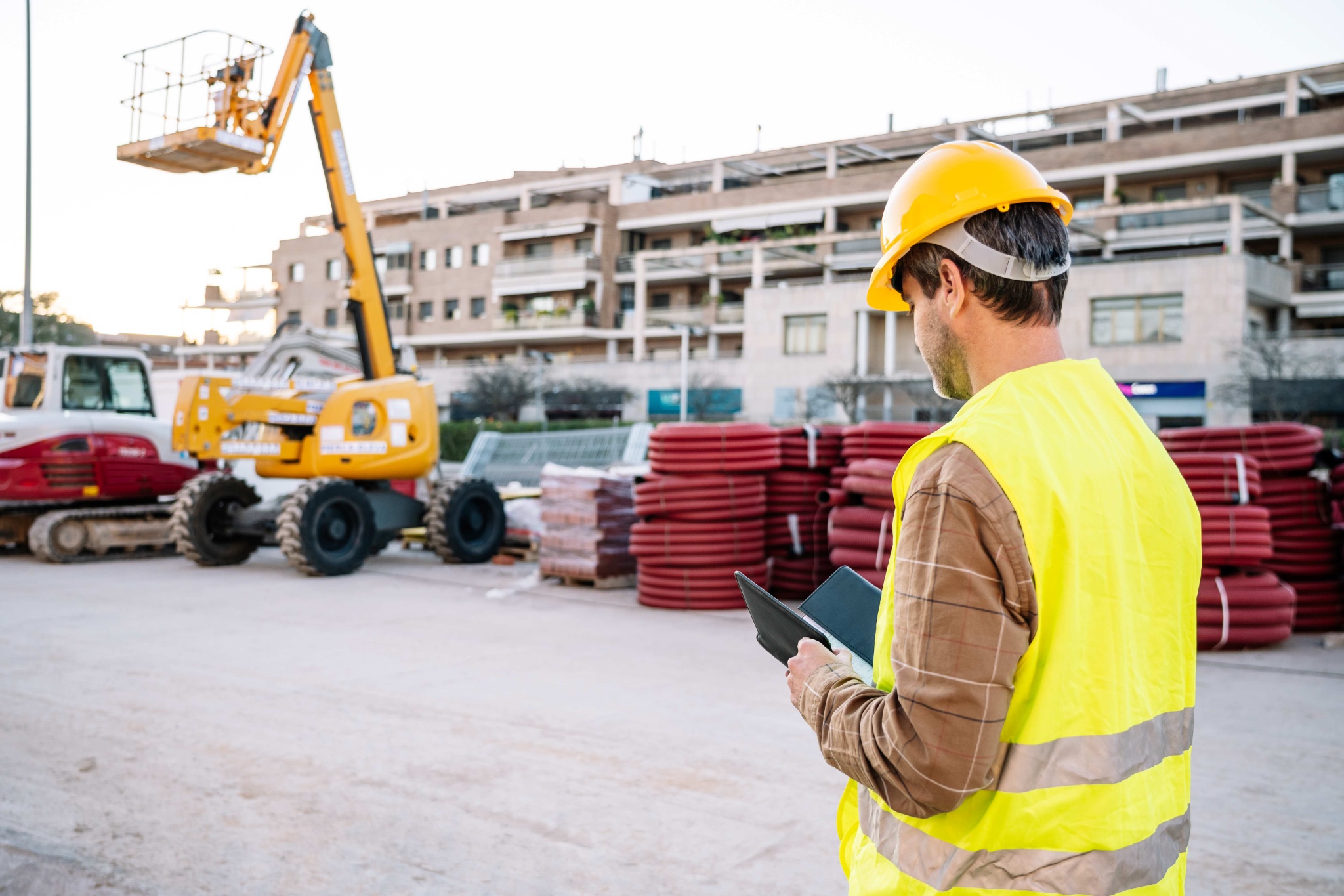 male-contractor-using-tablet-during-work-2023-11-27-04-54-35-utc